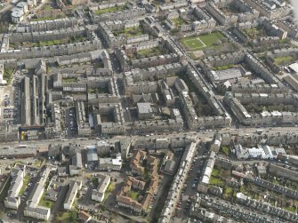 Oblique aerial view centred on part of Leith Walk, taken from the NW.