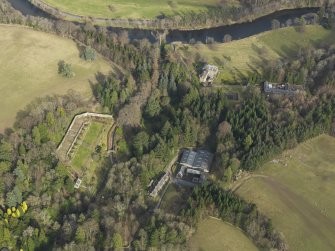 Oblique aerial view centred on the walled garden with the country house adjacent, taken from the W.