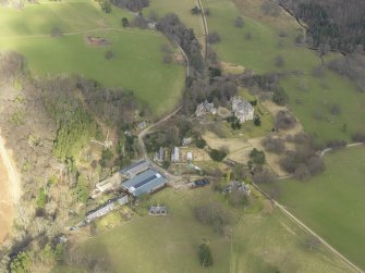 General oblique aerial view centred on the country house, taken from the SW.