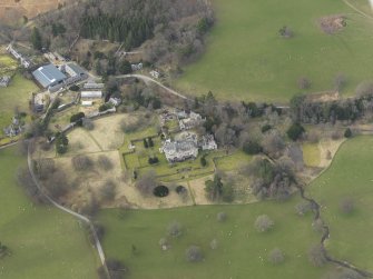 General oblique aerial view centred on the country house, taken from the SE.