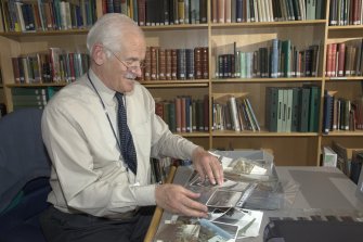 Volunteer John Knight at work in the library.