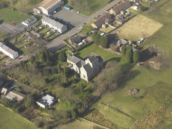 Oblique aerial view centred on the Preceptory and parish church, taken from the SE.