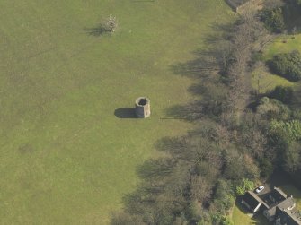 Oblique aerial view centred on the dovecot, taken from the NW.