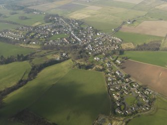 General oblique aerial view centred on the village, taken from the SE.