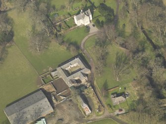 Oblique aerial view centred on the Home Farm with Old Leckie house adjacent, taken from the SSW.