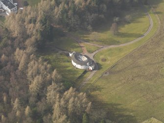 Oblique aerial view centred on the garage, taken from the SE.