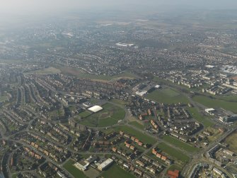 General oblique aerial view centred on the community centre, taken from the SE.