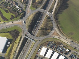 Oblique aerial view centred on the motorway interchange, taken from the (vertical) SE.