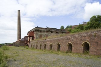 Chimney, generator-house and brick kilns, general view from SE