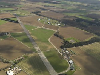 General oblique aerial view of East Fortune Airfield, taken from the NW.