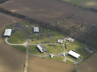 Oblique aerial view of East Fortune Airfield technical area, taken from the NW.