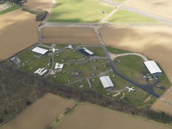 Oblique aerial view of East Fortune Airfield technical area, taken from the SE.