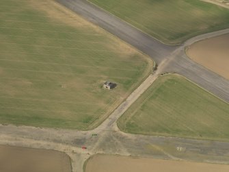 Oblique aerial view of East Fortune Airfield control tower, taken from the SE.