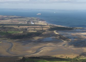 General oblique aerial view looking over Hedderwick Sands with the Bass Rock in the distance, taken from the SSE.