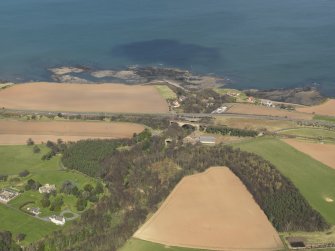 General oblique aerial view of Dunglass House and bridges, taken from the SSW.