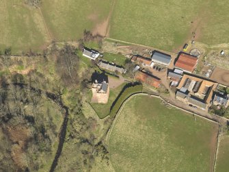 Oblique aerial view of Stoneypath Tower with farmstead adjacent, taken from the SW.