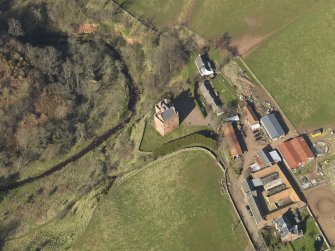 Oblique aerial view of Stoneypath Tower with farmstead adjacent, taken from the SSW.