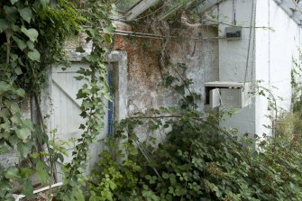 Interior. View showing doorway in original rear wall