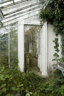 Interior. Detail of doorway leading to melon pit