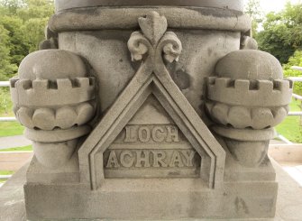 Detail of carving on WNW face of statue plinth atop the Stewart Memorial Fountain, inscribed "Loch Achray"