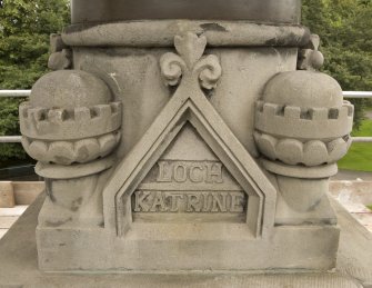 Detail of carving on SSW face of statue plinth atop the Stewart Memorial Fountain, inscribed "Loch Katrine"