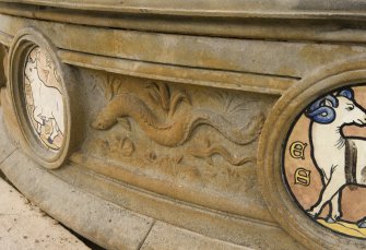 Detail of decorative carving and astrological roundels on central water basin of Stewart Memorial Fountain, Kelvingrove Park, Glasgow
