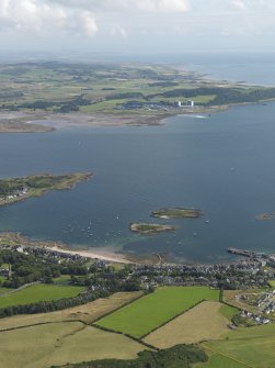 General oblique aerial view looking across the Fairlie Roads with Millport in the foreground and the Hunterston Nuclear Generating Stations in the distance, taken from the NE.