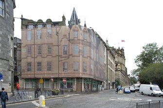 View of Market Street building with facade printed covering over the scaffold, taken from north east