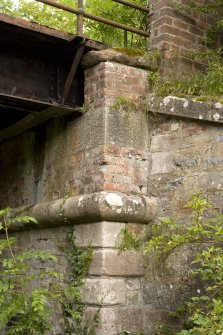 Detail of SE pier abutment showing inserted brickwork and string course.