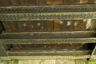 Detail of a section of the wooden underside decking with girders..