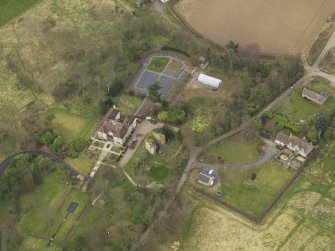 Oblique aerial view centred on the house with the tower-house adjacent, taken from the SE.