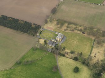 Oblique aerial view centred on the country house with the garden adjacent, taken from the NNE.