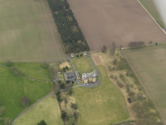 Oblique aerial view centred on the country house with the garden adjacent, taken from the NNW.