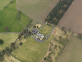 Oblique aerial view centred on the country house with the garden adjacent, taken from the NW.