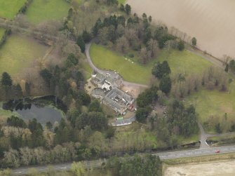 Oblique aerial view centred on the castle (hotel), taken from the N.