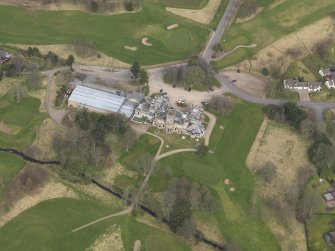 Oblique aerial view centred on the country house (hotel),  taken from the SW.