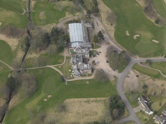 Oblique aerial view centred on the country house (hotel),  taken from the SE.