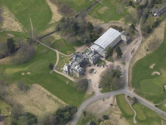 Oblique aerial view centred on the country house (hotel),  taken from the E.