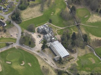 Oblique aerial view centred on the country house (hotel),  taken from the NNW.