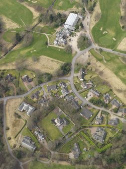 Oblique aerial view centred on the stables with the country house (hotel) adjacent,  taken from the  SE.