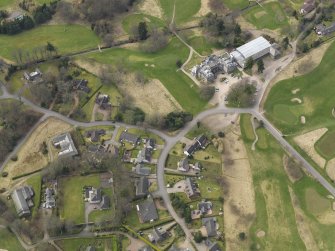 Oblique aerial view centred on the stables with the country house (hotel) adjacent,  taken from the E.