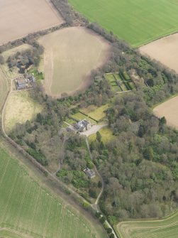 Oblique aerial view centred on the country house with the walled garden adjacent, taken from the WNW.