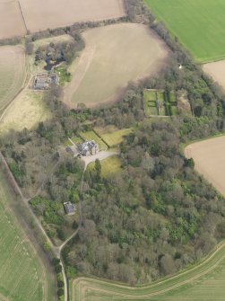 Oblique aerial view centred on the country house with the walled garden adjacent, taken from the WSW.