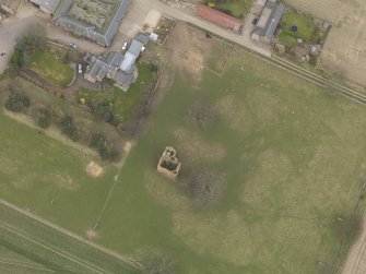 General oblique aerial view centred on the remains of the tower-house, taken from the SW.
