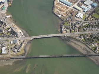 General oblique aerial view centred on the rail and road bridges, taken from the WNW.