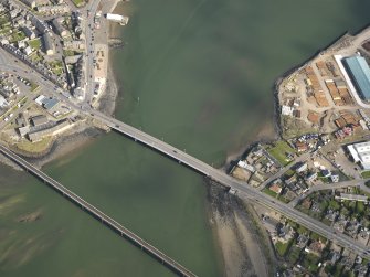 General oblique aerial view centred on the rail and road bridges, taken from the W.