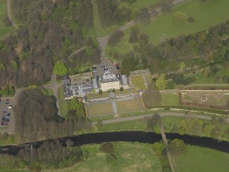 Oblique aerial view centred on the house, taken from the SW.