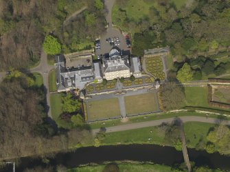 General oblique aerial view centred on the house, taken from the SSW.