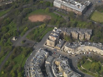 Oblique aerial view centred on the fire damaged tenement, taken from the S.