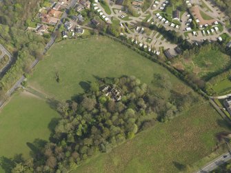 Oblique aerial view centred on the remains of the Country House, taken from the NW.